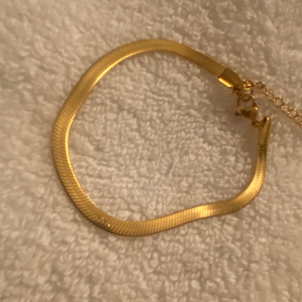 Gold plated bracelet over stainless steel